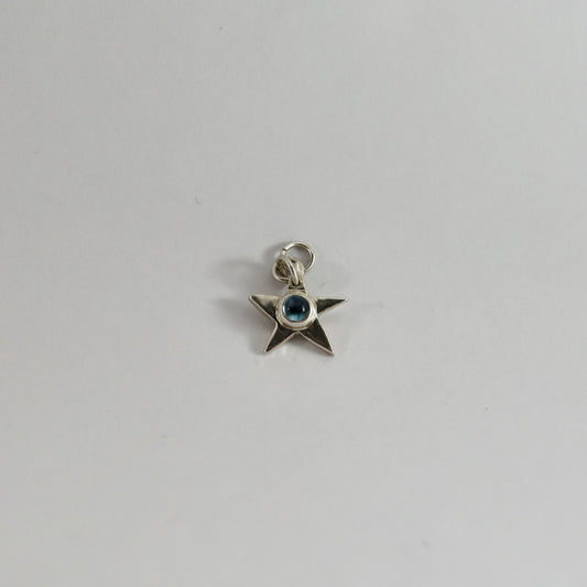 Topaz star charm