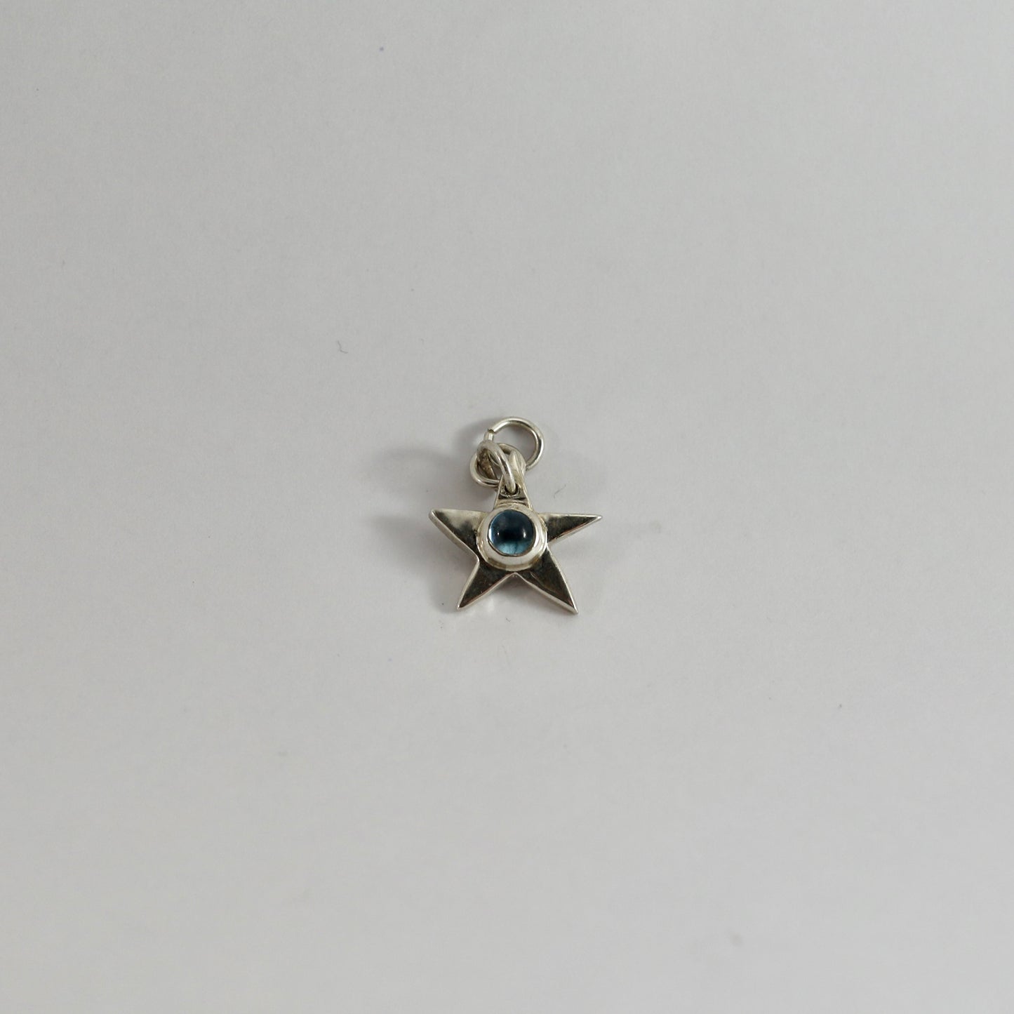Topaz star charm