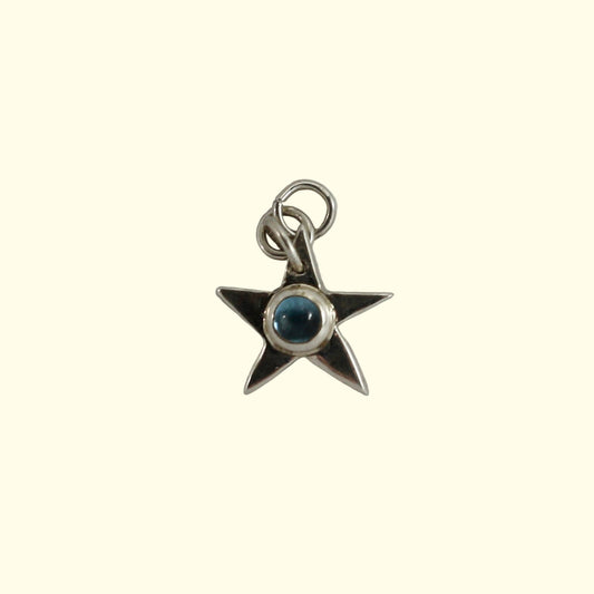 Topaz star charm