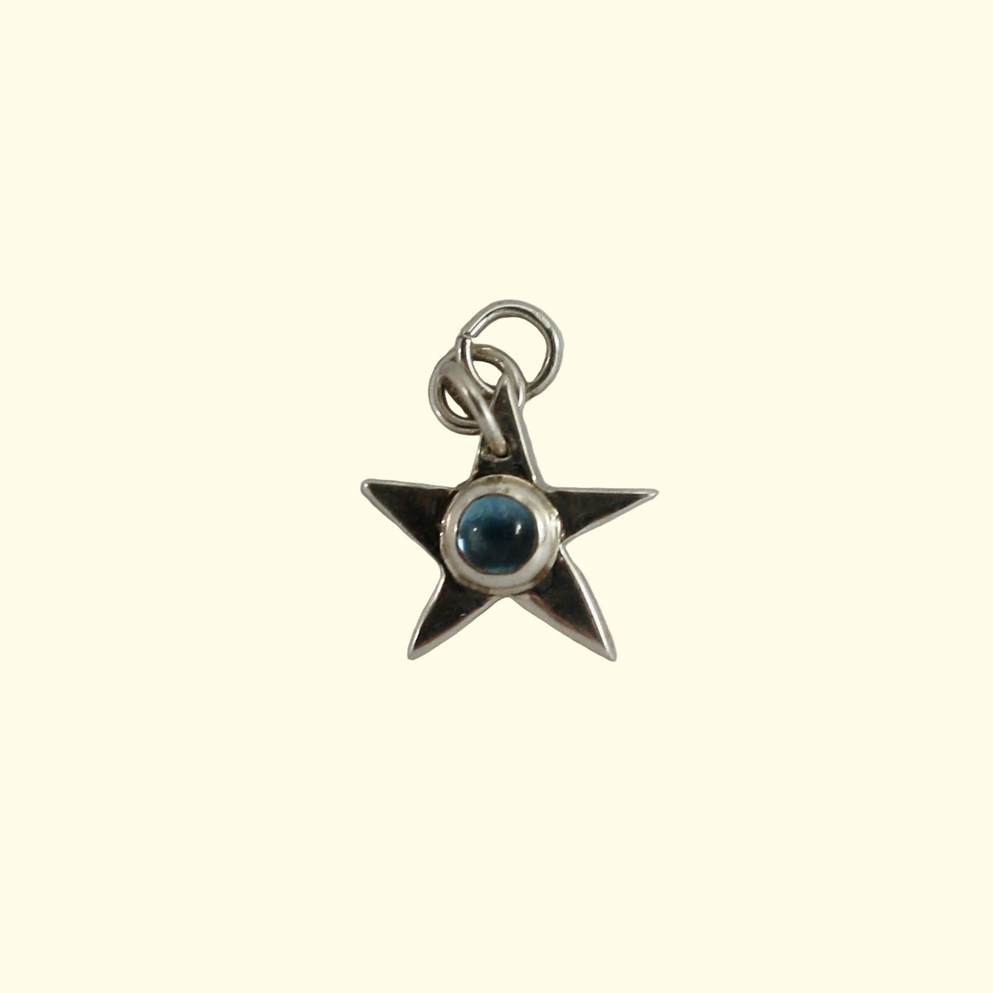 Topaz star charm